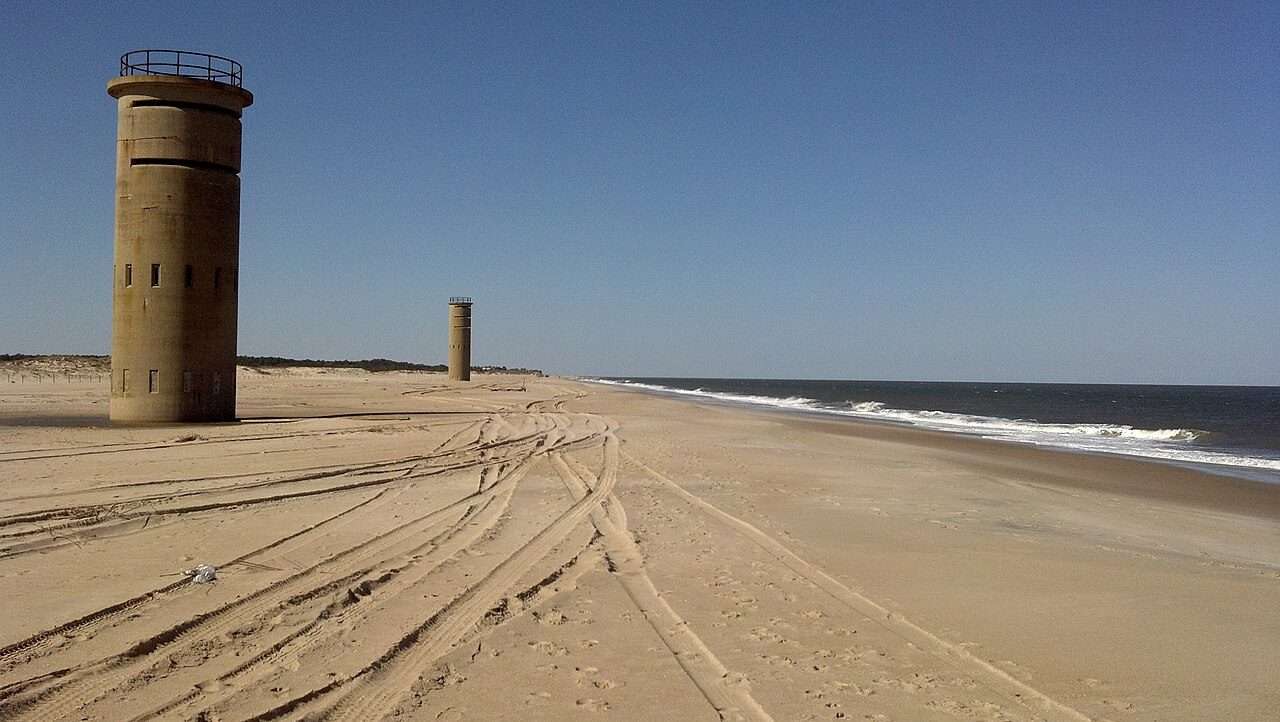 WWII-era fire control towers rising beyond Gordons Pond, Cape Henlopen State Park, Delaware
